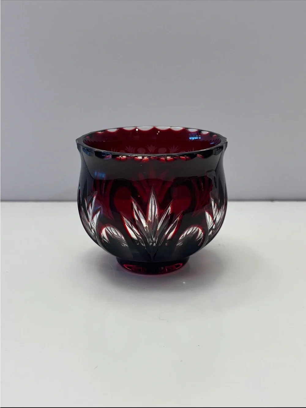 Bohemian Red Crystal glass votive candle holder features intricate cut-to-clear